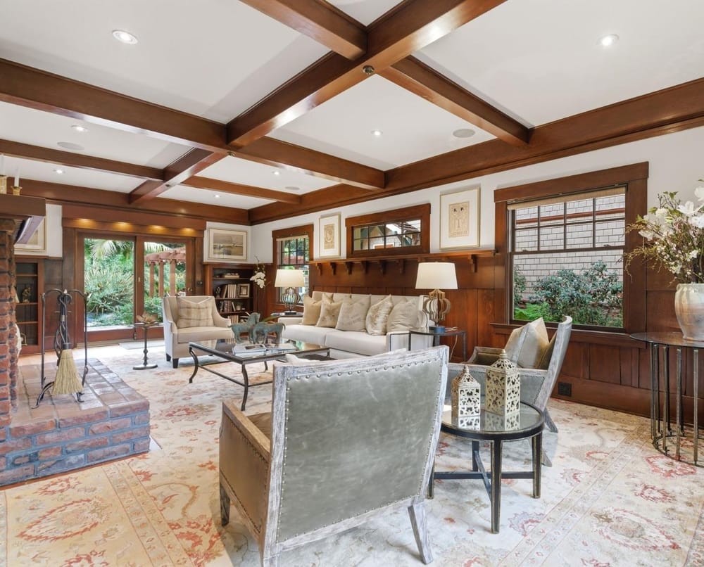 Living room with coffered ceiling and garden views